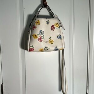 Kate Spade cream colored floral handbag w/duster bag. Barely used